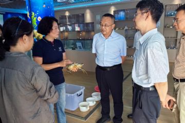 农业农村部全国水产技术推广总站副站长陈家勇与广西壮族自治区农…